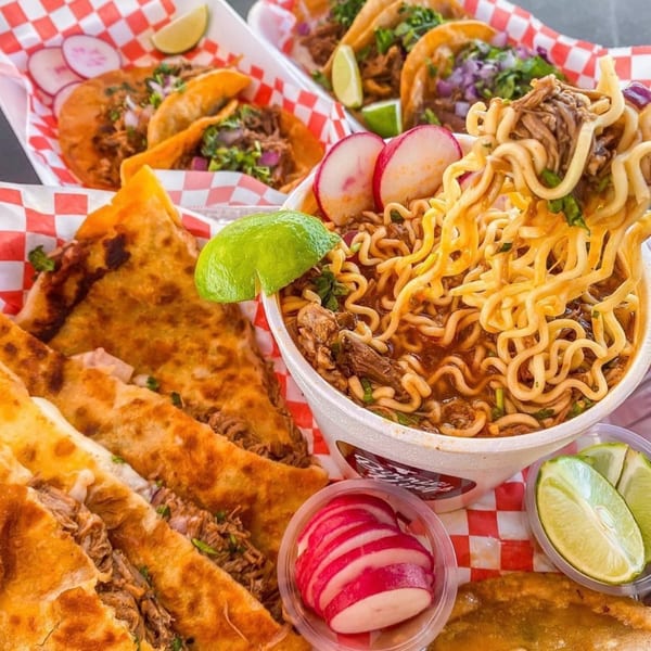 Birria ramen, tacos, and quesadillas with limes and radishes from Cafe772 Cantina & Grill.